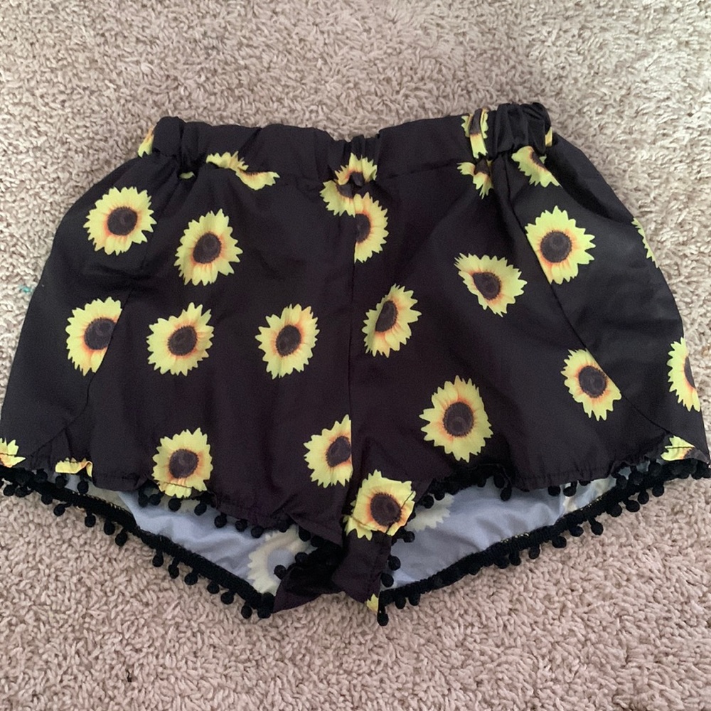 Black sunflower shorts. They didn’t suite me so I’m selling them.